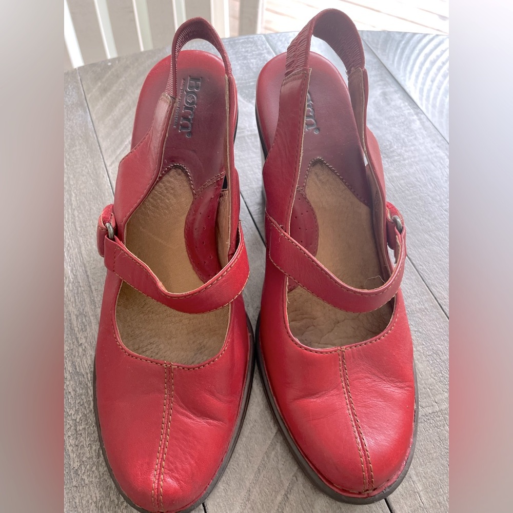 Woman’s size 8 red leather Born heels with elastic band and velcro buckle.